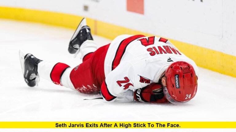 Seth Jarvis exits after a high stick to the face